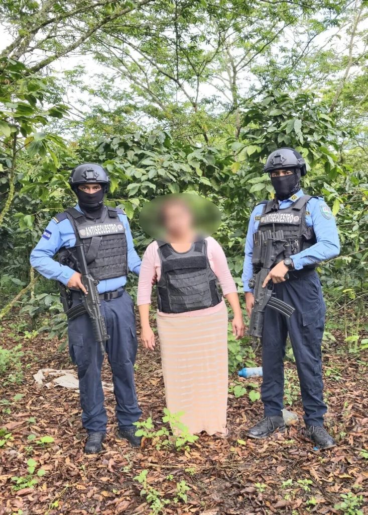 Woman guarded by police